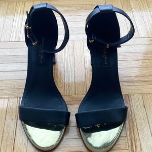 Black 100% leather block sandals with gold accents. Hight: 2.3”. Gently worn.